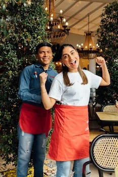 restaurant manager in uniform smiling