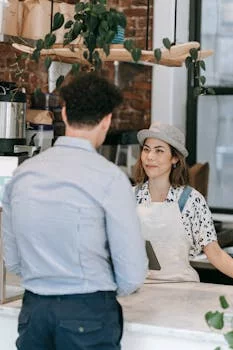 cashier smiling at register counter